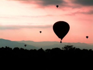 Albuquerque International Balloon Fiesta Balloons dot the sky over the Sandia Mountains at sunrise in Albuquerque, New Mexico during the Albuquerque International Balloon Fiesta. Enter to win a trip to the world's largest balloon festival at www.ItsATrip.org/balloon-festival. Photo credit: www.morimotophotography.com. (PRNewsFoto/Albuquerque Convention & Visitors Bureau)