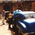 American Visitors Admire an American Car in Havana, Cuba, Dec. 2003